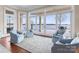 Light-filled sunroom with lake views, hardwood floors, and patio access at 8228 Bay Pointe Dr, Denver, NC 28037