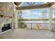 Balcony features stone fireplace and a beautiful lake view at 8813 Graham Rd, Denver, NC 28037