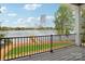 Spacious balcony with railing overlooking a serene lake view at 8813 Graham Rd, Denver, NC 28037