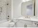 Stylish bathroom with a mosaic tiled shower and a modern vanity with gold fixtures at 8813 Graham Rd, Denver, NC 28037