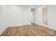 Bright bedroom with hardwood flooring, white walls and two entry doors at 8813 Graham Rd, Denver, NC 28037