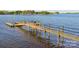 Waterfront dock on the lake with seating, perfect for enjoying the lake view at 8813 Graham Rd, Denver, NC 28037