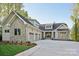 Stunning home with stone and siding, a three-car garage, and meticulously maintained landscaping at 8813 Graham Rd, Denver, NC 28037