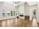 Bright and airy living room with fireplace, large windows, and hardwood floors at 8813 Graham Rd, Denver, NC 28037