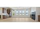 The living room includes a wet bar, fireplace and a wall of windows with views of the lake at 8813 Graham Rd, Denver, NC 28037