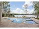 Beautiful pool and lake view from backyard with patio space at 8813 Graham Rd, Denver, NC 28037