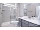 Modern bathroom with walk-in shower, sleek vanity, and contemporary fixtures at 9007 Raven Top Dr, Mint Hill, NC 28227