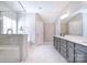 Full bathroom featuring a glass shower, soaking tub, dual sink vanity, and neutral color palette at 9007 Raven Top Dr, Mint Hill, NC 28227