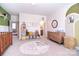 Bright Bedroom with round rug, crib, comfortable furnishings, and soft lighting perfect for a growing Gathering at 9007 Raven Top Dr, Mint Hill, NC 28227