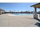 Resort-style community pool with ample lounging space and a shaded pavilion area for residents at 9007 Raven Top Dr, Mint Hill, NC 28227