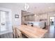 Open dining area with a wood table, connecting to the kitchen and living spaces at 9007 Raven Top Dr, Mint Hill, NC 28227