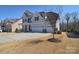 Beautiful two story home with a three car garage and well manicured front yard at 9007 Raven Top Dr, Mint Hill, NC 28227