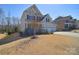 Well maintained two story home with a three car garage and beautiful landscaping at 9007 Raven Top Dr, Mint Hill, NC 28227