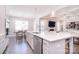 Bright, open kitchen featuring a large island, stainless steel appliances, and modern finishes at 9007 Raven Top Dr, Mint Hill, NC 28227