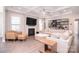 Inviting living room featuring a fireplace, modern furnishings, and a coffered ceiling at 9007 Raven Top Dr, Mint Hill, NC 28227