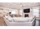 Bright living room with fireplace, coffered ceilings, and an open layout with seamless access to the kitchen at 9007 Raven Top Dr, Mint Hill, NC 28227