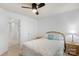 Inviting bedroom with a ceiling fan, neutral walls, comfortable bed, and seamless access to the hallway at 9017 Lanark Ln, Fort Mill, SC 29707