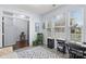 Sunlit home office with a stylish rug and views to another room, providing a functional and inviting workspace at 9017 Lanark Ln, Fort Mill, SC 29707