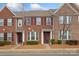 Attractive brick townhome with well-manicured landscaping and classic architectural details at 9017 Lanark Ln, Fort Mill, SC 29707