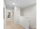 Bright hallway with neutral walls and carpet, offering seamless transitions to the home's living spaces at 9017 Lanark Ln, Fort Mill, SC 29707