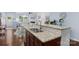 Kitchen sink with granite countertop and a view into the living room and dining area at 9017 Lanark Ln, Fort Mill, SC 29707