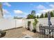 Outdoor patio area with paver flooring, plants, and a white vinyl fence at 9017 Lanark Ln, Fort Mill, SC 29707