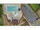 Bird's eye view of a community pool, playground and ample parking space, set within a lush landscape at 9017 Lanark Ln, Fort Mill, SC 29707