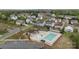 Community pool with lounge chairs and a play area, surrounded by well-maintained homes and greenery at 9017 Lanark Ln, Fort Mill, SC 29707