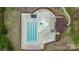 Overhead shot of a pristine community pool featuring marked lanes, a play area, and lounge amenities at 9017 Lanark Ln, Fort Mill, SC 29707