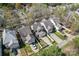 Aerial view showcases neighborhood homes with well-maintained lawns and white picket fences at 9113 Cinder Ln, Huntersville, NC 28078