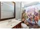 Bathroom featuring a stylish vanity, mirror, and a fun, dinosaur-themed shower curtain at 9113 Cinder Ln, Huntersville, NC 28078