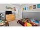 bedroom featuring playful dinosaur themed decor, neutral paint, and soft carpet at 9113 Cinder Ln, Huntersville, NC 28078