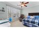 Comfortable bedroom with a blue plaid comforter, and a ceiling fan to create a relaxed atmosphere at 9113 Cinder Ln, Huntersville, NC 28078