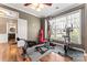 Home gym with exercise equipment and plenty of natural light at 9113 Cinder Ln, Huntersville, NC 28078