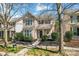 Charming two-story home featuring a welcoming front porch and beautifully landscaped front yard at 9113 Cinder Ln, Huntersville, NC 28078