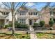 Charming two-story home featuring a welcoming front porch and beautifully landscaped front yard at 9113 Cinder Ln, Huntersville, NC 28078