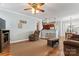 Open-concept living room with hardwood floors, opening to the kitchen and dining area at 9113 Cinder Ln, Huntersville, NC 28078