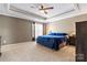 Comfortable main bedroom with a ceiling fan, and soft carpet to create a warm, inviting atmosphere at 9113 Cinder Ln, Huntersville, NC 28078