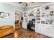 Inviting home office featuring built-in shelving, desk space, hardwood floors, and a cozy, functional workspace at 9113 Cinder Ln, Huntersville, NC 28078