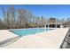 Community pool with a large sundeck and a covered seating area, perfect for recreation at 9937 Travertine Trl, Davidson, NC 28036