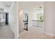 A spacious second story hallway has carpet, modern railing, and a view of a bedroom at 9937 Travertine Trl, Davidson, NC 28036