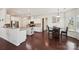 Bright kitchen with an island, granite countertops, and hardwood floors at 9937 Travertine Trl, Davidson, NC 28036