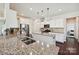 Bright kitchen with white cabinets, granite countertops, stainless steel appliances, and a central island with pendant lighting at 9937 Travertine Trl, Davidson, NC 28036