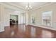 Bright living room showcasing hardwood floors and an open view to office and foyer at 9937 Travertine Trl, Davidson, NC 28036