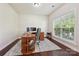 Comfortable office space with a window and classic hardwood floors at 9937 Travertine Trl, Davidson, NC 28036