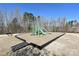 Community playground area with swings, slide, and climbing structure, offering outdoor fun at 9937 Travertine Trl, Davidson, NC 28036