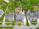Aerial view of a well-manicured home with mature trees and landscaping at 11523 Warfield Ave, Huntersville, NC 28078