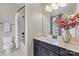 Clean bathroom design featuring a shower-tub combo, neutral colors, and a marble countertop at 11523 Warfield Ave, Huntersville, NC 28078