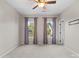 Spacious bedroom with two windows and modern ceiling fan at 11523 Warfield Ave, Huntersville, NC 28078