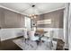 A dining room with a wood table, upholstered chairs, and a stylish chandelier above an area rug at 11523 Warfield Ave, Huntersville, NC 28078